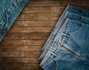 57509959-vintage-denim-jean-put-on-wooden-background-denim-texture-denim-textile-denim-background-